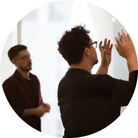 Person sketching ideas during an event planning session